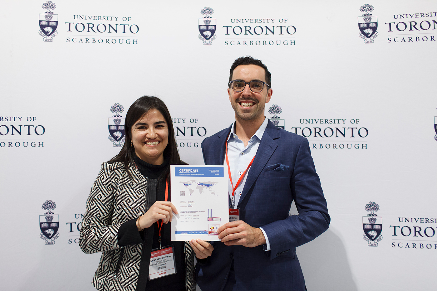 Peter Dushenski, GlasCurtain Managing Director, accepting the certificate for the world's first PHI-certified cold climate curtain wall from Elena Reyes Bernal, Passive House Canada Researcher, at the Passive House Canada Conference at University of Toronto Scarborough on October 17, 2019